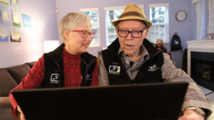 Cindy and Lester watching a Zinnia TV video